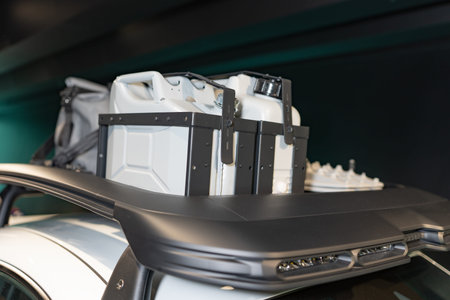 Fuel cans are fixed on the car body. SUV with canisters. fuel cans are fixed on the car body.