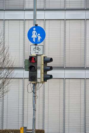 Red traffic light. Road sign on a pole. Traffic light and road sign pedestrian zone in Germany.の写真素材
