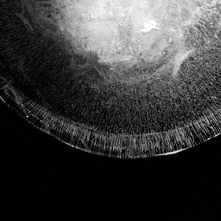 A piece of broken ice on a black background