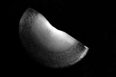 A piece of broken ice on a black backgroundの写真素材
