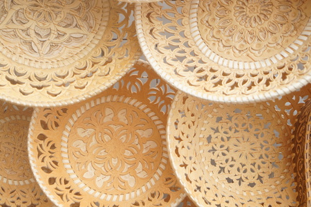 Plates and sugar bowls made of birch bark, Russian folk art, paintings on birch bark is applied in two ways: embossing or oil paints.の写真素材