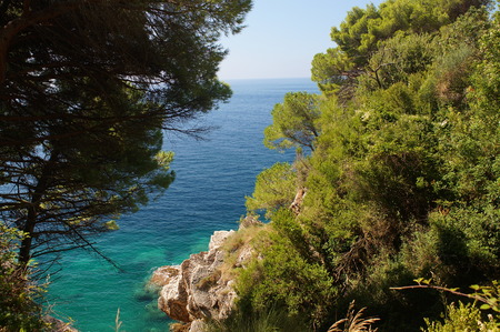 the sight of a traveler on the blue Adriatic sea, the horizon and the rocky coast of Montenegroの写真素材