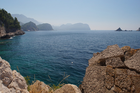 the ecologically cleanest Adriatic sea, rocky beach on the Montenegrin coast,horizon blue skyの写真素材
