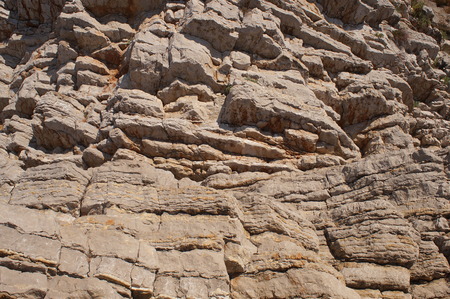 layered mountains of Montenegro are composed of sedimentary rocks of limestone natural granite pattern backgroundの写真素材