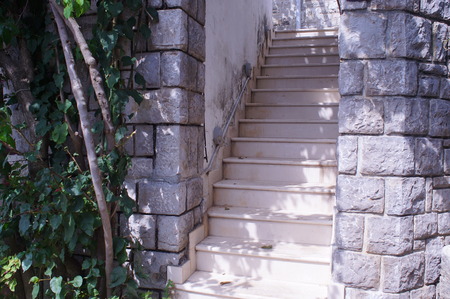old stairs leading to the house , a typical pattern for coastal cities of Montenegroの写真素材