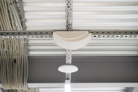 Ceiling frame made of metal profiles, electrical wires running across the ceilingの写真素材