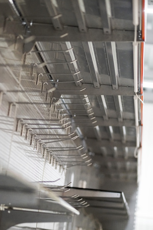 empty store shelves in super market, lighting fixtures and shelves for sale productの写真素材