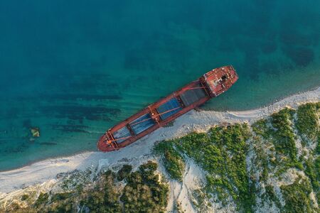 Shipwreck. Dry cargo ship left on coast.の写真素材