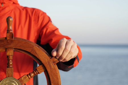 Hand on ship rudder.                    