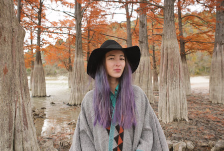 Girl in cypress trees.の写真素材