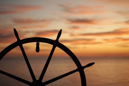 Ship rudder with sunset sea on background.        の写真素材