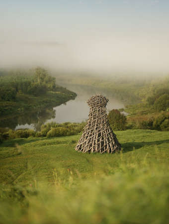 Russia, Nikola-Lenivets - 13 August 2019. Wooden sculpture Â«LighthouseÂ» in the Art Park Nikola Lenivets in morning light. Kaluga Region, Russia.のeditorial素材