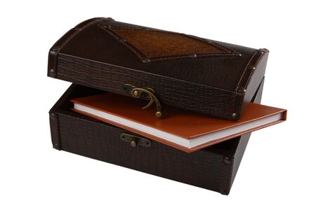 Wooden chest and diary on white backgroundの写真素材