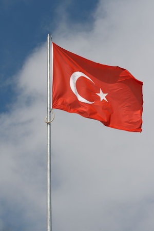 Red Turkish flag on blue sky background