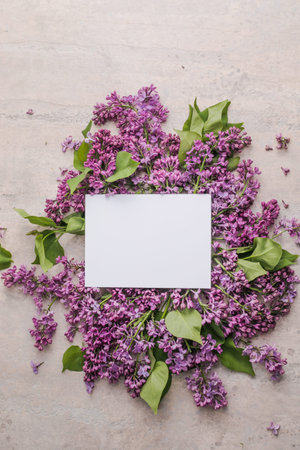 Mock up frame sheet. blossom Syringa vulgaris in Lilac flower and blank paper card for text...