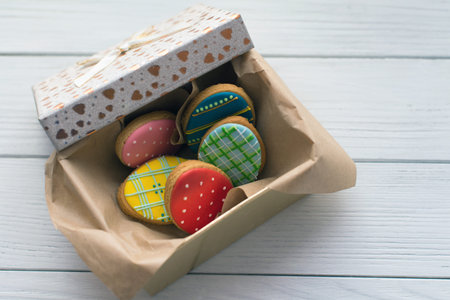 Easter cookies in a box on grey wooden background topview