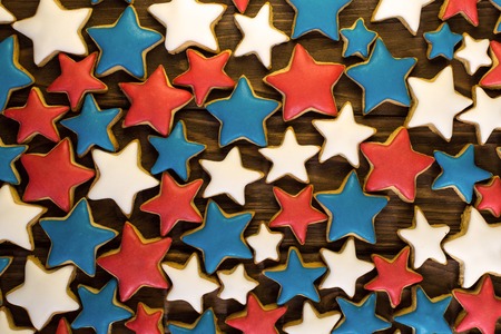 A lot of star shape ginger cookies on a wooden backgroundの写真素材