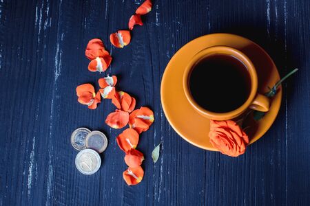 Coffee cup with rose and money - food industry conceptの写真素材