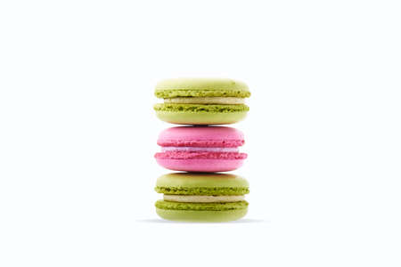 Isolated on white vibrant pink and green macaroons.の写真素材