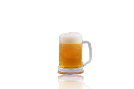 Mug fresh beer with cap of foam isolated on white background with reflection