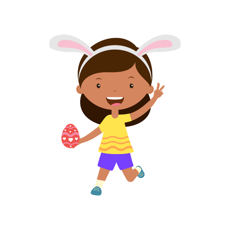 Cute laughing running girl with bunny ears holding egg in hand.Child hunting for easter eggsのイラスト素材