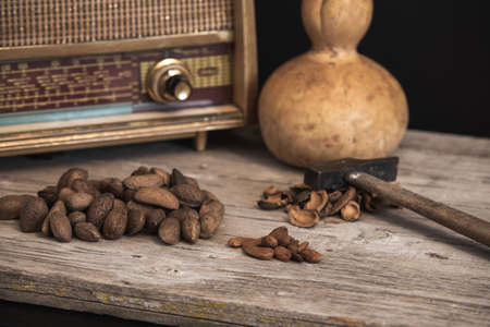rustic table to split almonds with old radio