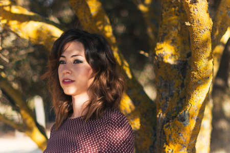 girl next to a treeの写真素材