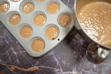 baking tray for making muffins on a dark marble backgroundの写真素材