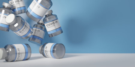 CORONAVIRUS VACCINE CANS FALLING ON WHITE TABLE WITH BLUE BACKGROUND. BANNERの写真素材