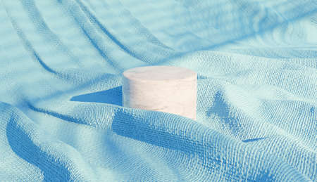 marble cylindrical product podium on blue wrinkled fabric with shadows of a shutter. 3d renderの写真素材