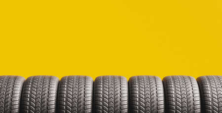 yellow background with tires peeking out from the bottom and space for text. 3d rendering