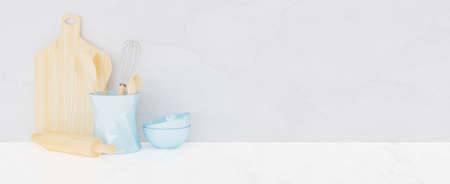 wooden kitchen utensils with pastel blue ceramic bowls on white background. 3d renderingの写真素材