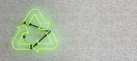 green neon lamp with recycling symbol on white brick wall. copy space. 3d renderの写真素材