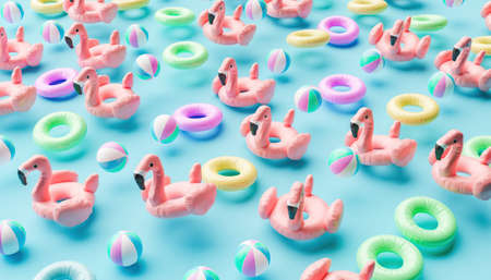 fun pattern of pastel colored swim floats with flamingos, balls and rings in the air. summer concept. 3d renderの写真素材
