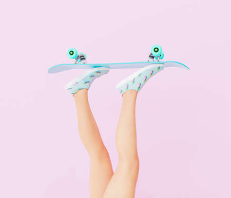 female legs with skateboard on pastel color background. vintage style. 3d render