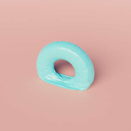 deflated pool float ring on pastel background. minimal scene. end of summer concept. 3d renderの写真素材