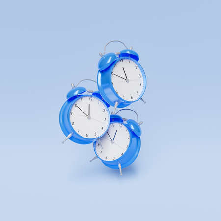alarm clocks floating in the air one above the other with blue background. 3d renderの写真素材