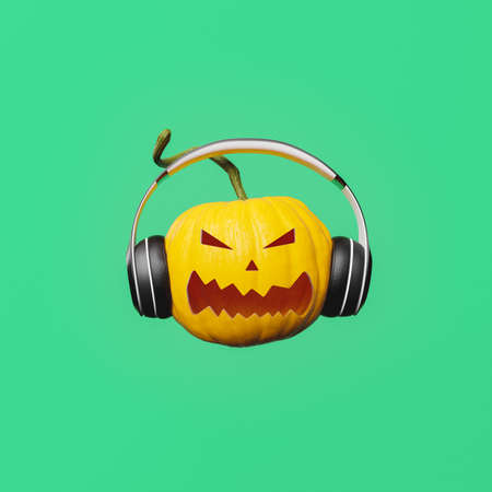 halloween pumpkin with angry face and headphones on green background. musical avatar. 3d renderingの写真素材