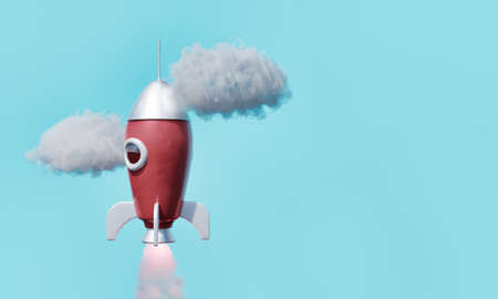 Red rocket taking off with clouds around and space for text in concept of startup, success and launch. 3d renderingの写真素材