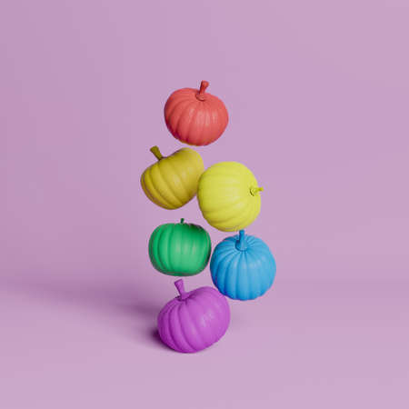 pumpkins floating in the air with colors of LGBTQ flag on pastel pink background. minimal concept of Halloween, autumn and inclusion. 3d renderingの写真素材