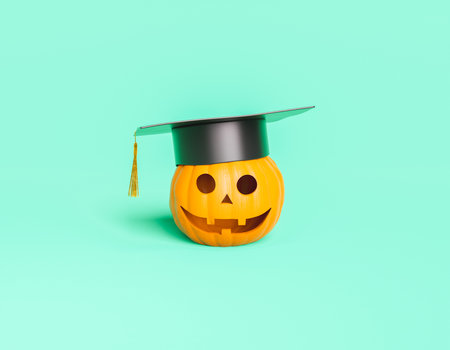 Halloween pumpkin with happy face and graduation hat. education concept. 3d renderingの写真素材