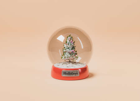 crystal ball with HOLIDAYS sign and a Christmas tree with falling snow. 3d renderingの写真素材