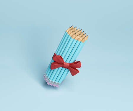 pencils tied with a decorative ribbon and floating on blue background. gift concept, art, culture and education. 3d renderingの写真素材