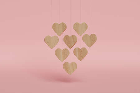 wooden hearts hanging with heart shape on red background. minimal concept of valentine, love,...