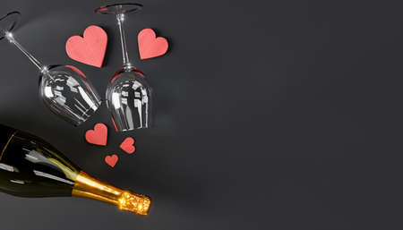 top view of a champagne bottle with two glasses and wooden hearts with copy space. concept of valentine's day, love, anniversary, dating, birthday and celebration. 3d renderingの写真素材