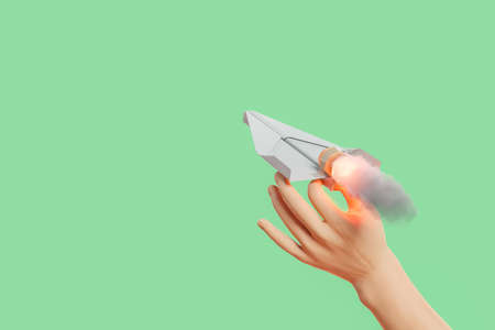 cartoon hand launching a propelled paper airplane. concept of impulse, thrust, education and startup. 3d renderingの写真素材