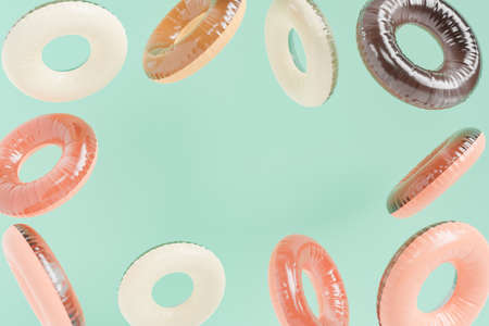 abstract background of inflatable rings with space for text. concept of summer, vacation, swimming, beach, pool and travel. 3d renderingの写真素材
