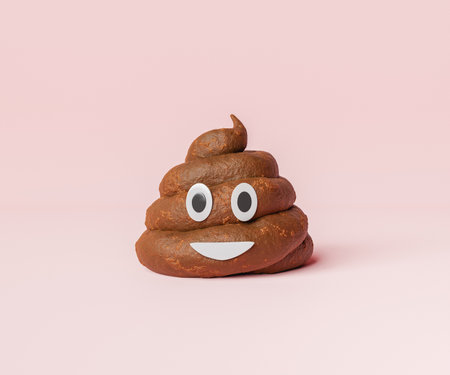 3d illustration of brown pile of poop with smiling face and eyes on pink backgroundの写真素材
