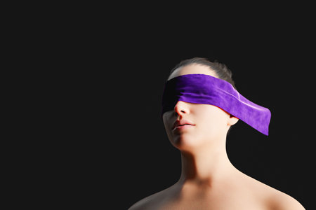 3D rendering of low angle of calm young female with bare shoulders and eyes covered with purple ribbon against black backgroundの写真素材