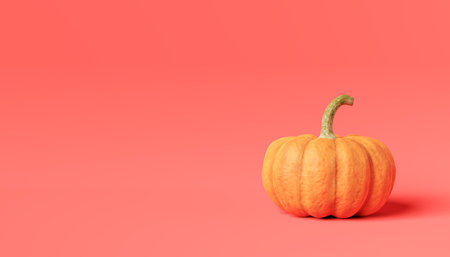 3d rendering of fresh ripe orange healthy aesthetic pumpkin vegetable placed on floor in light against pink backgroundの写真素材